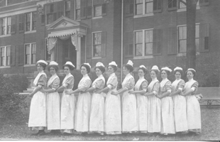 nurses lined up in front of the hospital